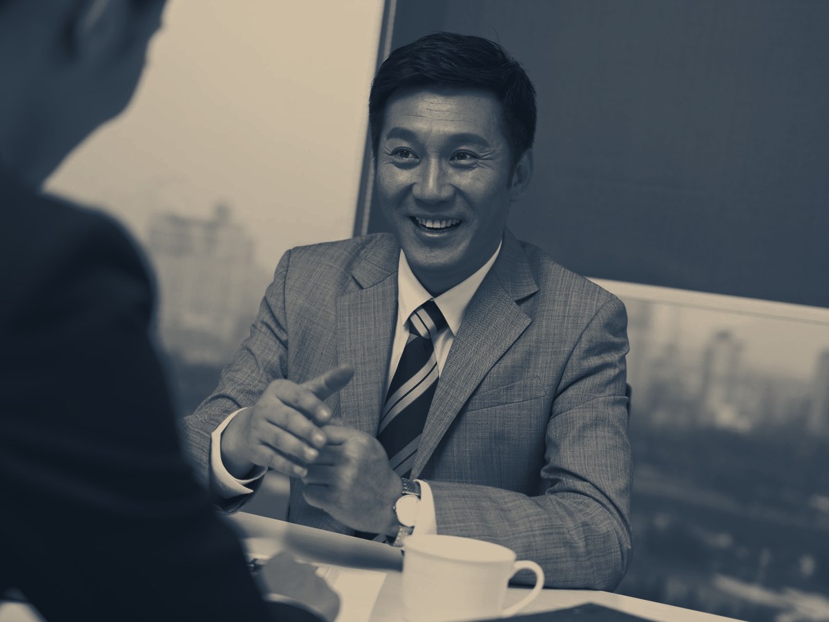 A consultant meeting an SME business owner